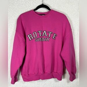 Rotate Sunday Iris Women's Carmine Rose Crew Neck Sweatshirt. This pink is 🔥